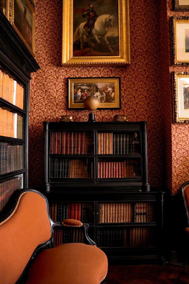 A room with a bookcase and a chair