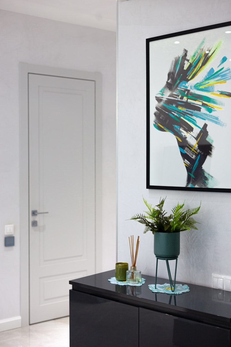 A living room with a large picture hanging on the wall